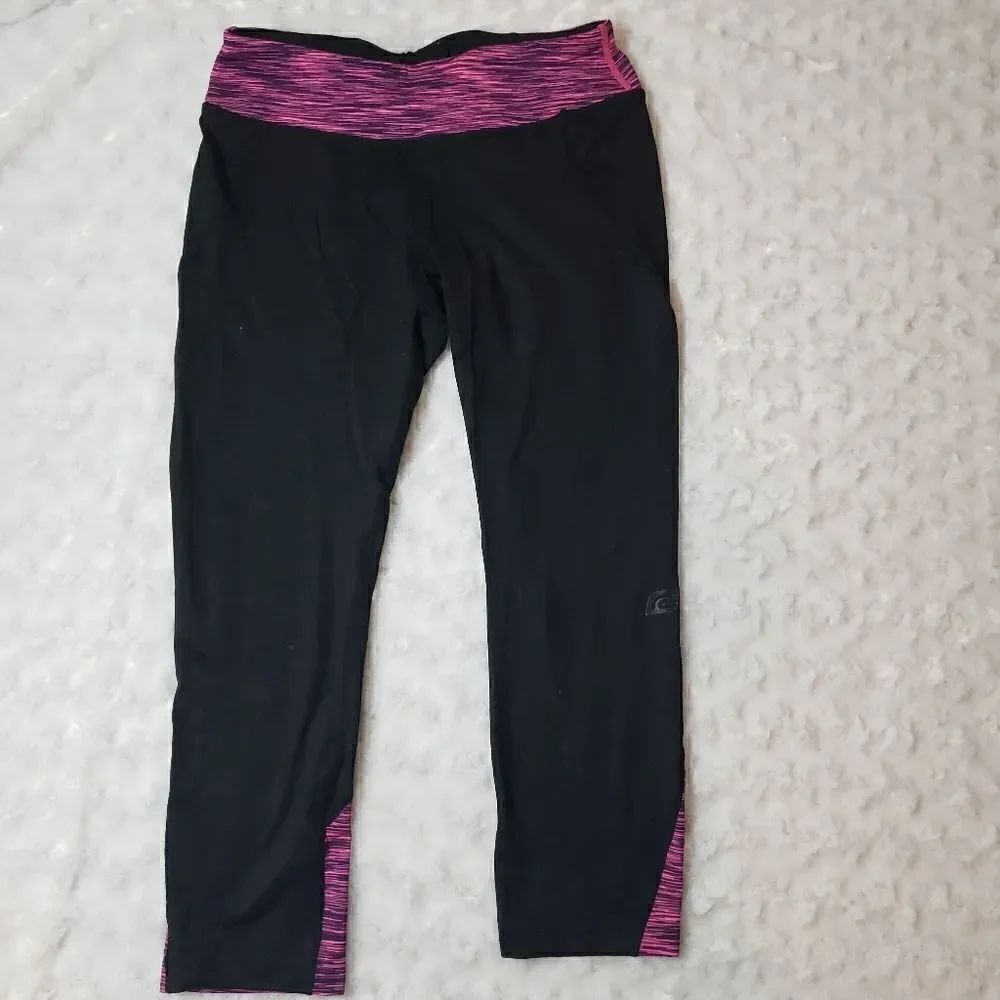Road Runner Sports size small running capris with pink space dye accents